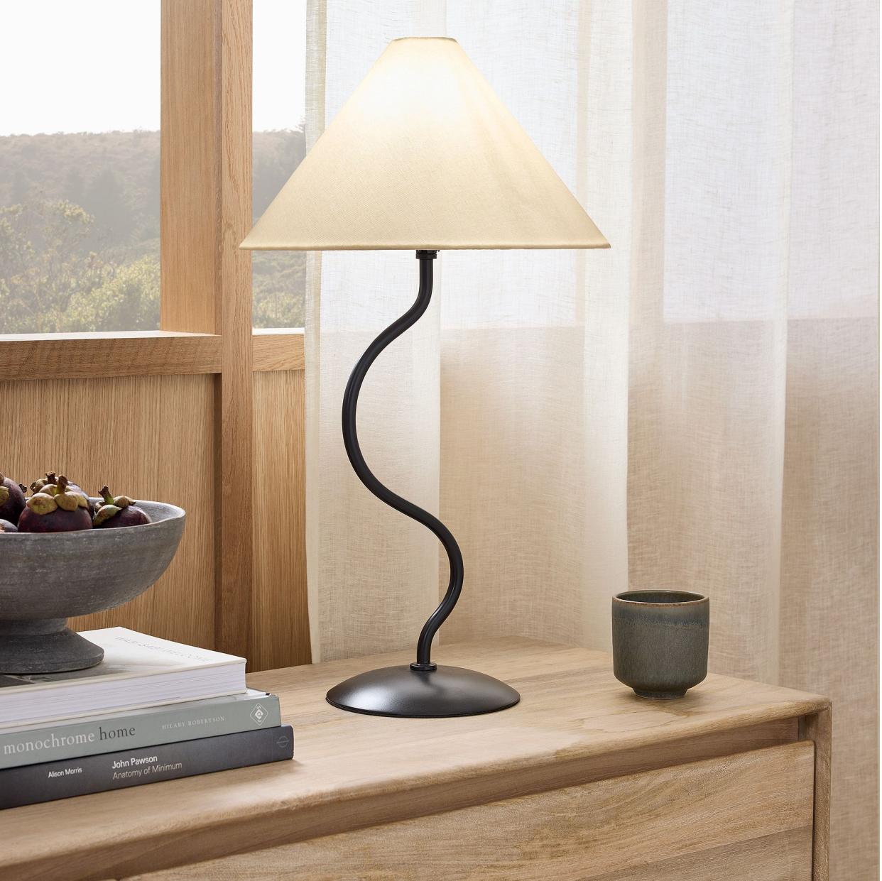 <p><a href="https://go.redirectingat.com?id=74968X1596630&url=https%3A%2F%2Fwww.westelm.com%2Fproducts%2Fzig-zag-table-lamp-h12173&sref=https%3A%2F%2Fwww.goodhousekeeping.com%2Fhome-products%2Fg60357640%2Fbest-table-lamps%2F" rel="nofollow noopener" target="_blank" data-ylk="slk:Shop Now;elm:context_link;itc:0;sec:content-canvas" class="link rapid-noclick-resp">Shop Now</a></p><p>Zigzag Table Lamp</p><p>westelm.com</p><p>$99.00</p>