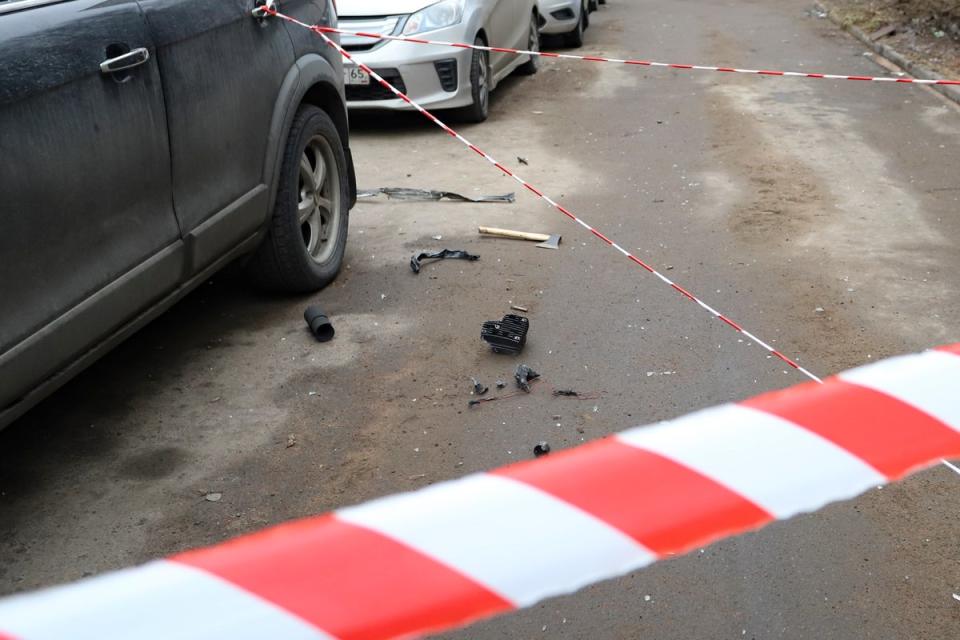 The wreckage of a drone near a damaged apartment's building after a reported drone attack in St Petersburg (AP)
