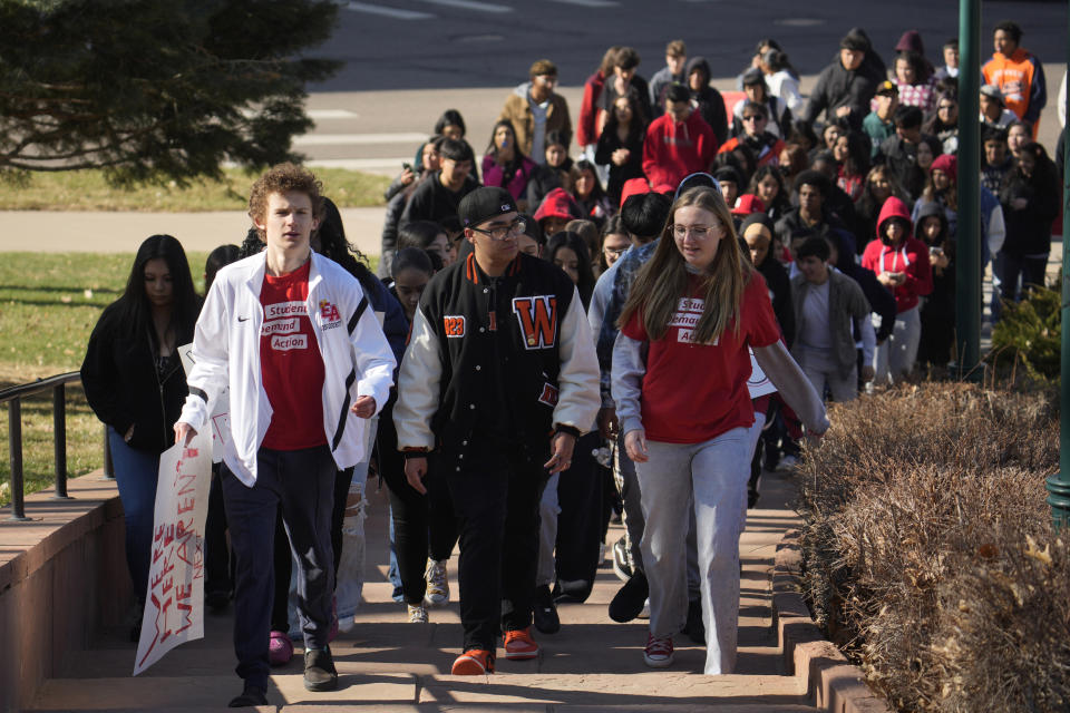 Students from East High School and West High School call for gun control measures to be considered by state lawmakers Thursday, March 23, 2023, during a rally outside the State Capitol in Denver. A shooting left two administrators injured at East High School on Wednesday, one of a series of gun-related events at the school in the past six weeks. (AP Photo/David Zalubowski)