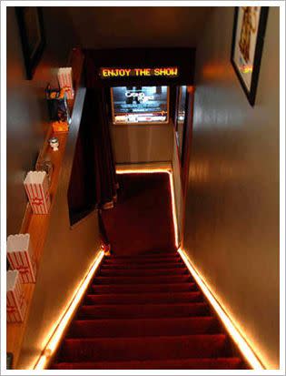 17) Welcome Guests with a Movie-Themed Stairwell