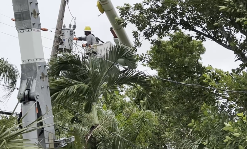 FPL worker repairs lines damaged as outer bands hit Miami-Dade County this week. (Source: Florida Power & Light)