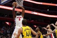 Feb 25, 2019; Detroit, MI, USA; Detroit Pistons center Andre Drummond (0) gets a rebound against Indiana Pacers forward Thaddeus Young (21) and forward Bojan Bogdanovic (44) during the fourth quarter at Little Caesars Arena. Mandatory Credit: Raj Mehta-USA TODAY Sports