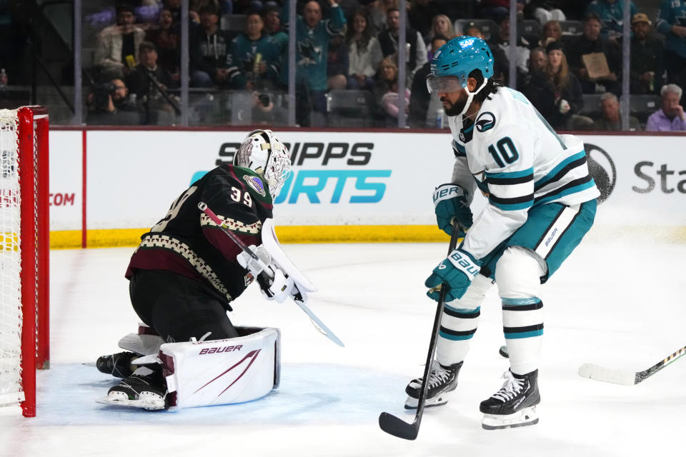 San Jose Sharks left wing Anthony Duclair (10) has his shot stopped by Arizona Coyotes goaltender Connor Ingram (39) during the second period of an NHL hockey game Friday, Dec. 15, 2023, in Tempe, Ariz. (AP Photo/Ross D. Franklin)