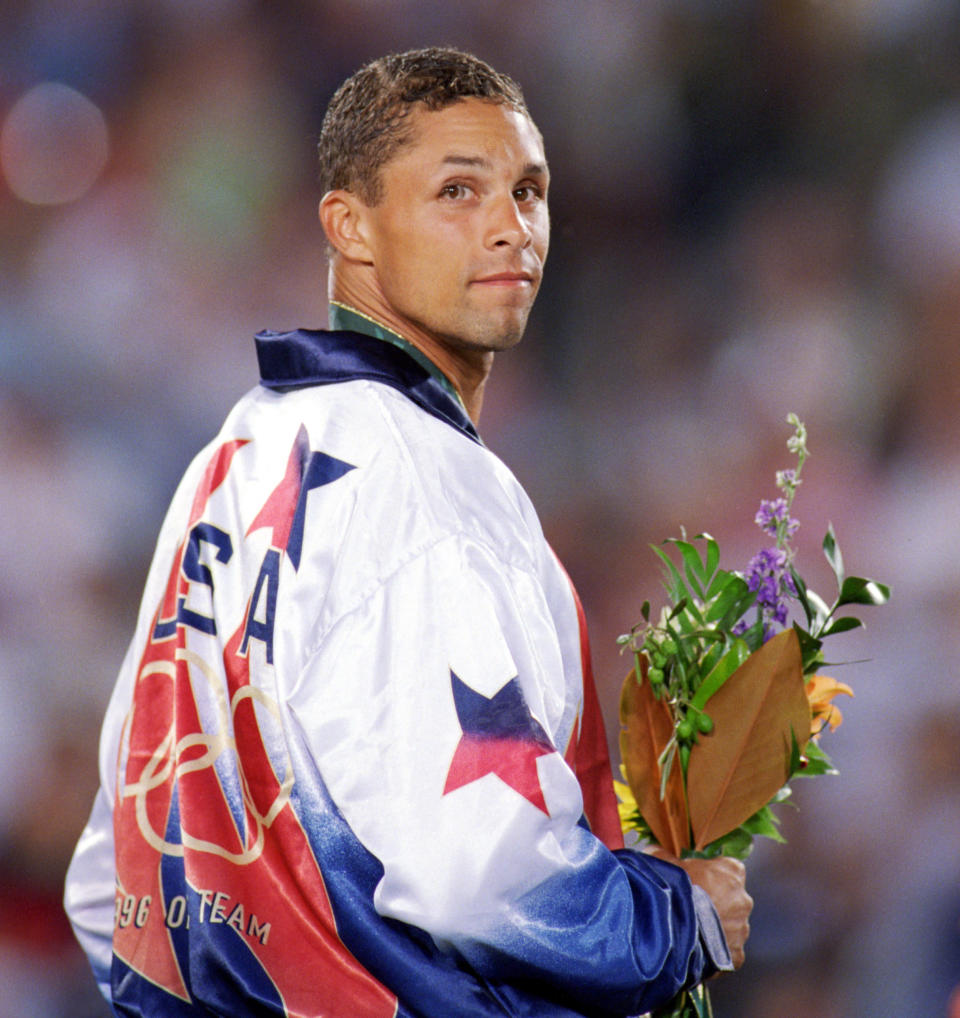 Dan O'Brien of the United States smiles after receiving his gold medal after winning the Men's Decathlon during the 1996 Olympic Games on August 1, 1996 at Olympic Stadium in Atlanta, Georgia. (Photo by Mike Powell/Getty Images)