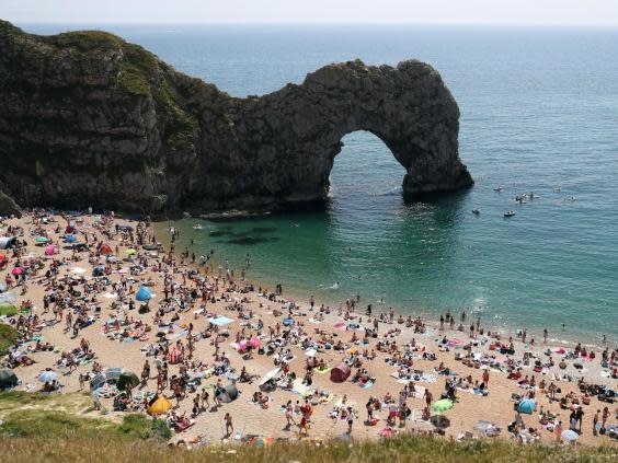 People flocked to Durdle Door in Dorset on Saturday (PA)