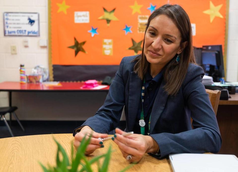 Principal Monica Ordaz talks about Saira Olivo’s work as the family engagement specialist Tuesday, Sept. 27, 2022, at Cesar Chavez Elementary School in Fort Worth.