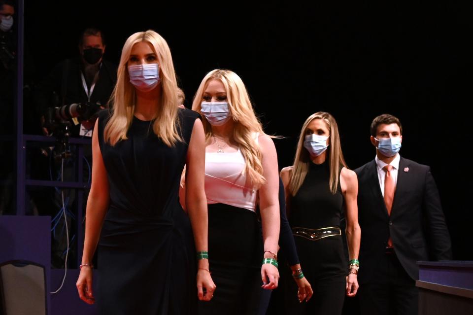 (From L) Daughter and Senior Advisor to the US President Ivanka Trump, daughter of the US President Tiffany Trump, campaign adviser to the US President and Eric Trump's wife Lara Trump wear facemasks as they arrive to attend the final presidential debate at Belmont University in Nashville, Tennessee, on October 22, 2020.