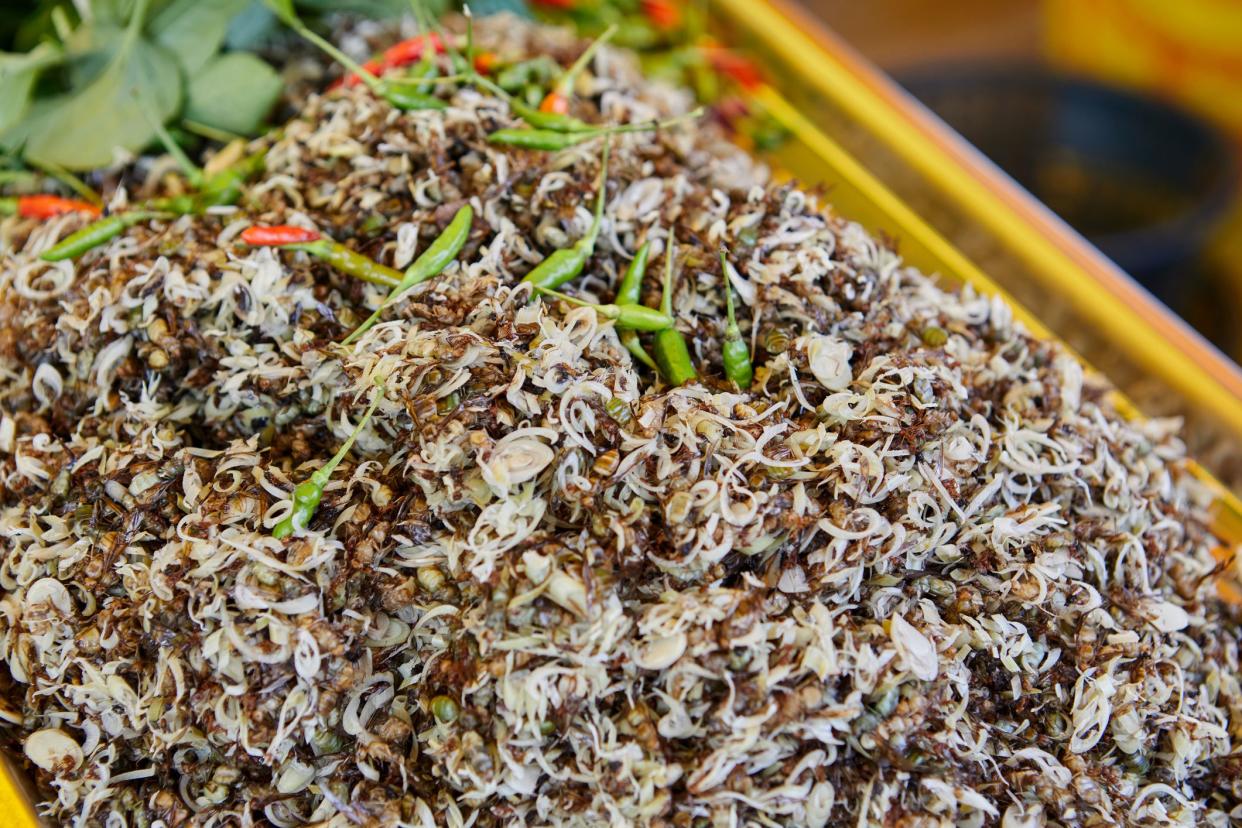 Ant eggs spicy salad with herbs or Yum Khai Mod Daeng