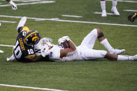 Northwestern linebacker Jeremiah McDonald intercepts a pass in front of Iowa running back Mekhi Sargent, left, during the second half of an NCAA college football game, Saturday, Oct. 31, 2020, in Iowa City, Iowa. (AP Photo/Charlie Neibergall)