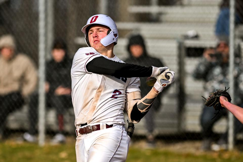 Okemos' Caleb Bonemer swings at a Mason pitch during the seventh inning on Friday, April 5, 2024, at Mason High School.