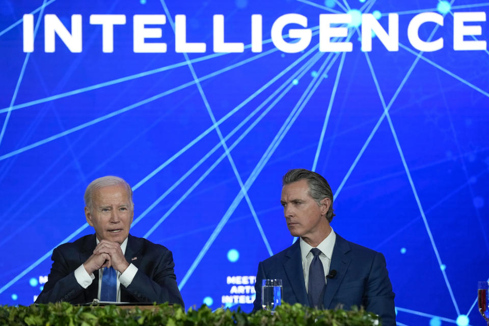 President Joe Biden speaks during a discussion on managing the risks of Artificial Intelligence during an event in San Francisco, Tuesday, June 20, 2023, as California Gov. Gavin Newsom listens. (AP Photo/Susan Walsh)