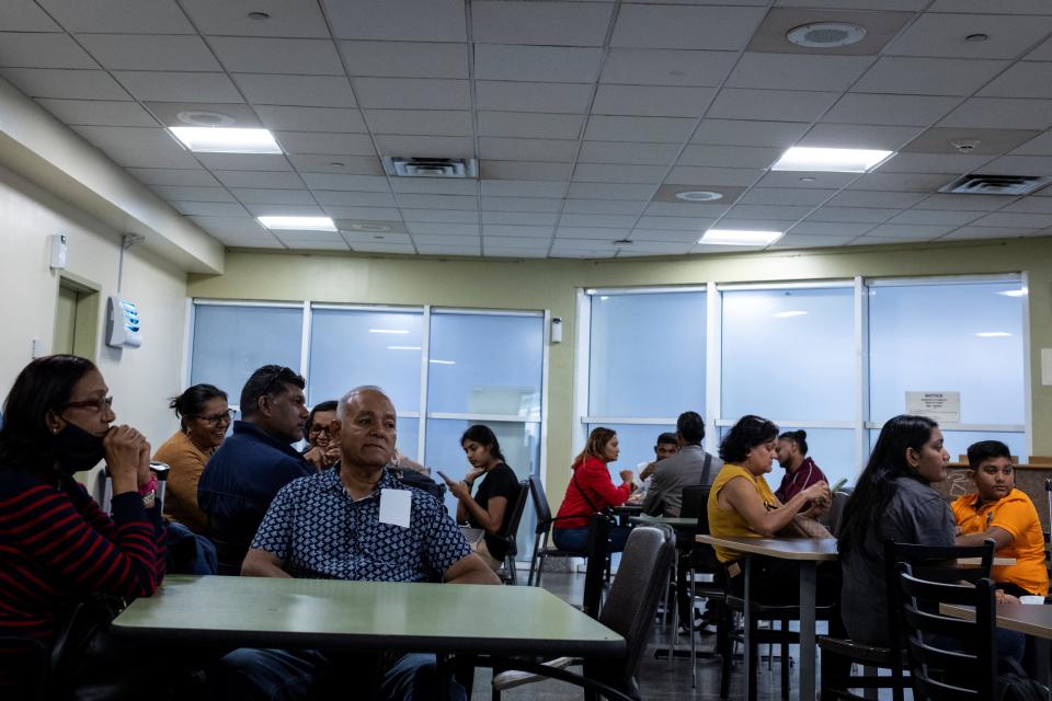 People wait at the Piarco International Airport as several flights are canceled due to Hurricane Beryl, in Piarco, Trinidad and Tobago, Monday.