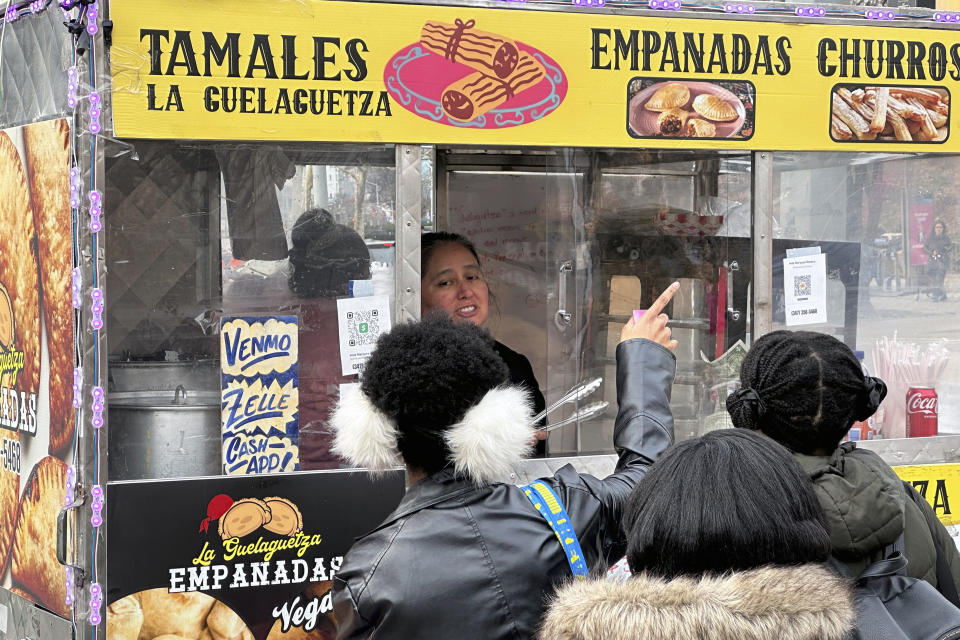 A sign on a food cart notifies customers they can pay using cash apps in Brooklyn, New York City, on Saturday, February 10, 2024. (AP Photo/Ted Shaffrey)