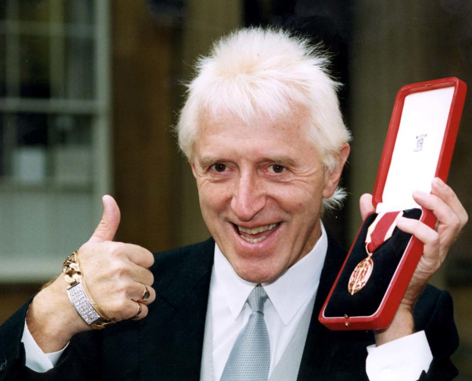 Sir James Savile, with his knighthood from the Queen. See SHOWBIZ Savile. Photo by Jim James.   (Photo by Jim James - PA Images/PA Images via Getty Images)