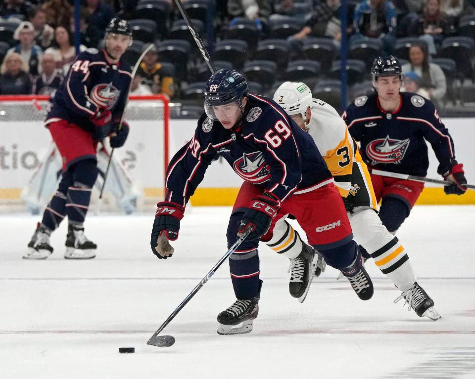 Sept. 24, 2023; Columbus, Oh., USA; 
Columbus Blue Jackets forward Jordan Dumais (69) is pursued by Pittsburg Penguins defender Jack St. Ivany (3) during the first period of Sunday's hockey game at Nationwide Arena.