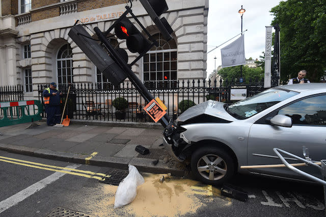 Emergency services attend the scene after a car crashed into a lamp post in Harley Street, adjacent to Cavendish Square, central London.