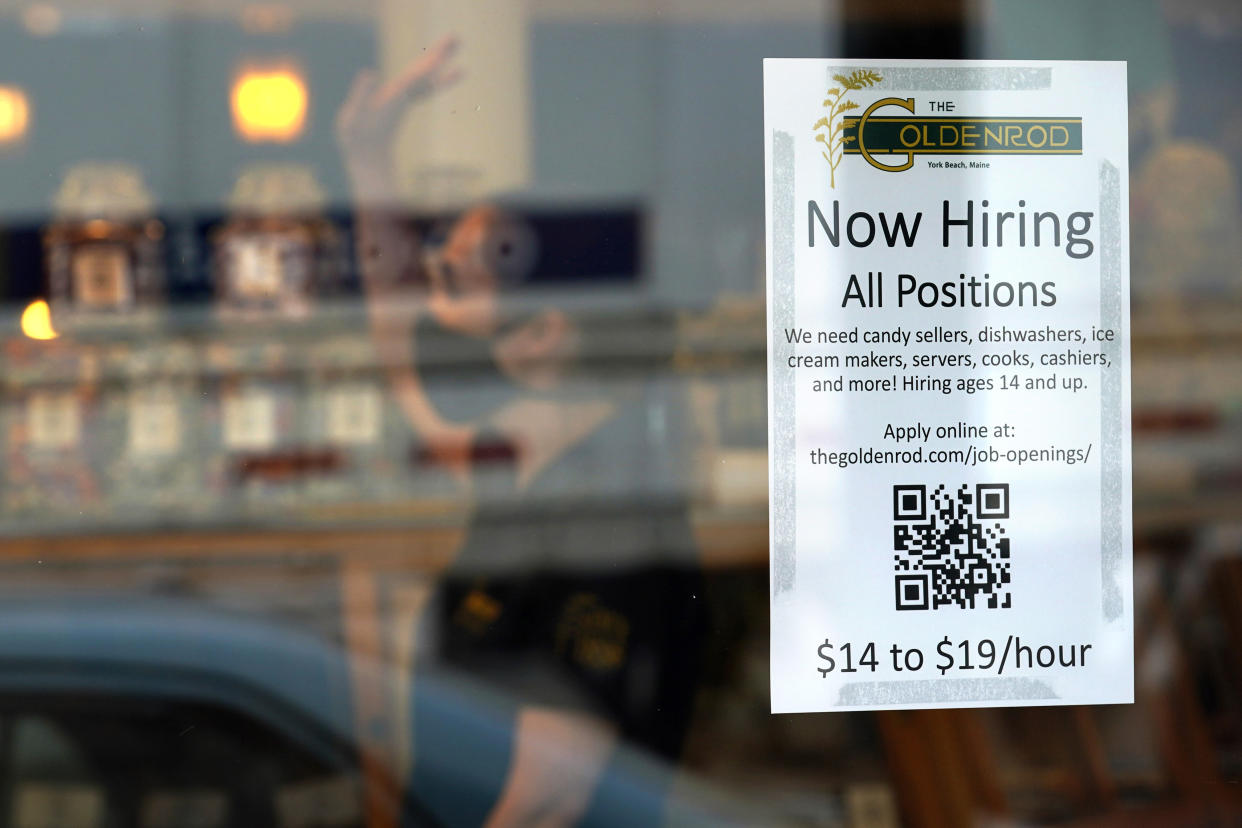 A sign advertises for help The Goldenrod, a popular restaurant and candy shop, Wednesday, June 1, 2022, in York Beach, Maine. The business is looking to hire 30 to 40 more workers in addition to the 70 or so it now employs. (AP Photo/Robert F. Bukaty)