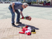 Bob Horan of Anaheim leaves flowers at a memorial outside Angel Stadium in Anaheim on Monday, July 1, 2019 in memory of Angel pitcher Tyler Skaggs who died in Texas at the age of 27 (Photo by Leonard Ortiz/MediaNews Group/Orange County Register via Getty Images)