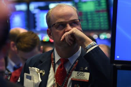 A trader looks on while waiting for the initial price of Tencent Music Entertainment company's IPO on the floor of the New York Stock Exchange (NYSE) in New York, U.S., December 12, 2018. REUTERS/Bryan R Smith