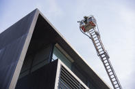 Firefighters work to extinguish a fire at the building housing the Danish Taxation Ministry, in Copenhagen, Denmark, Thursday June 27, 2024. A fire on Thursday broken out on top of a building housing Denmark’s Taxation Ministry in downtown Copenhagen, leading to the evacuation of the people inside the harbor-front glass-and-steel constrution and from adjacent houses. There was no word on casulaties.(Martin Sylvest/Ritzau Scanpix via AP)