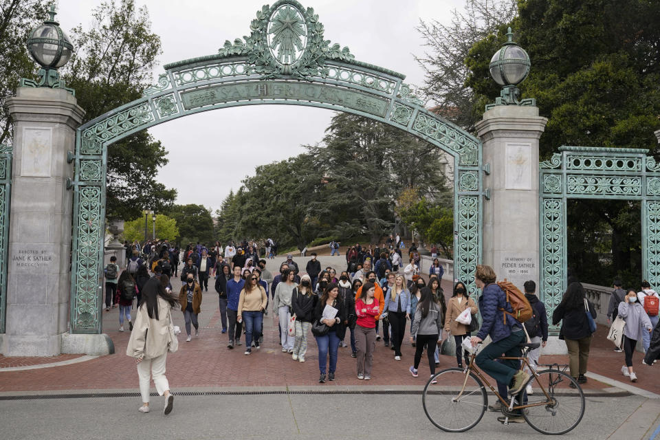 FILE - Students make their way through the Sather Gate near Sproul Plaza on the University of California, Berkeley, campus Tuesday, March 29, 2022, in Berkeley, Calif. After statewide bans on affirmative action in states from California to Florida, colleges have tried a range of strategies to achieve a diverse student body – giving greater preference to low-income families and admitting top students from communities across their states. But after years of experimentation, some states requiring race-neutral policies have seen drops in Black and Hispanic enrollments. (AP Photo/Eric Risberg, File)