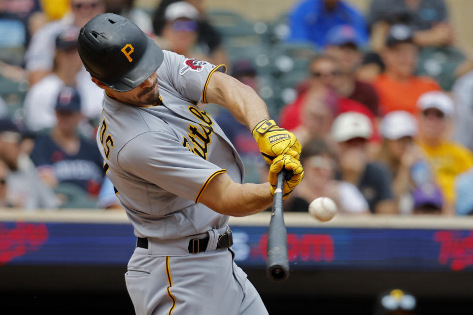 Pittsburgh Pirates' Bryan Reynolds breaks up a perfect game with a double against the Minnesota Twins in the seventh inning of a baseball game Sunday, Aug. 20, 2023, in Minneapolis. (AP Photo/Bruce Kluckhohn)