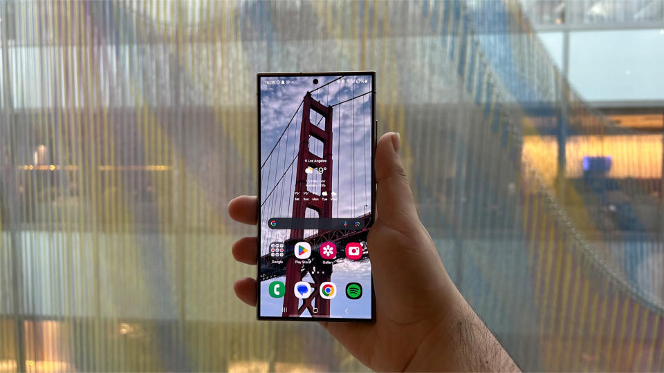 Samsung Galaxy S24 Ultra held in portrait with a bridge on screen