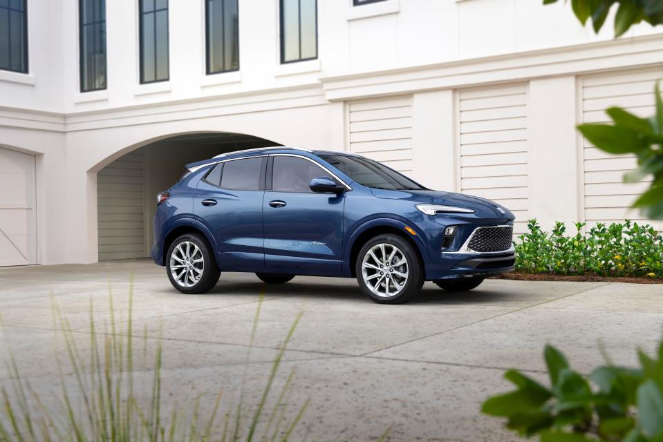 A front seven-eighths view of the 2024 Buick Encore GX Avenir in Ocean Blue Metallic. Preproduction model shown. Actual production model may vary. Available in spring 2023.