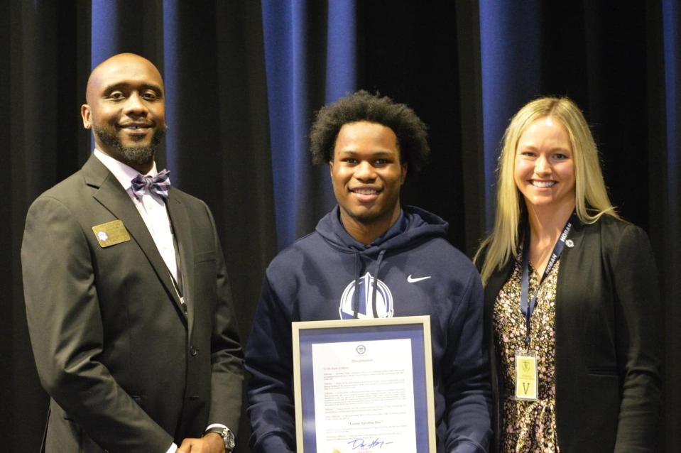 Akron Mayor Dan Horrigan named Jan. 20, 2023, "Lamar Sperling Day" to honor the Archbishop Hoban football star. Director of Strategic Development Catey Breck and Youth and Community Opportunity Director Denico Buckley-Knight presented Sperling with the proclamation.