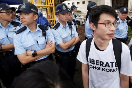 Activists march to major international consulates in an attempt to rally foreign governments' support for their fight against a controversial extradition bill in Hong Kong