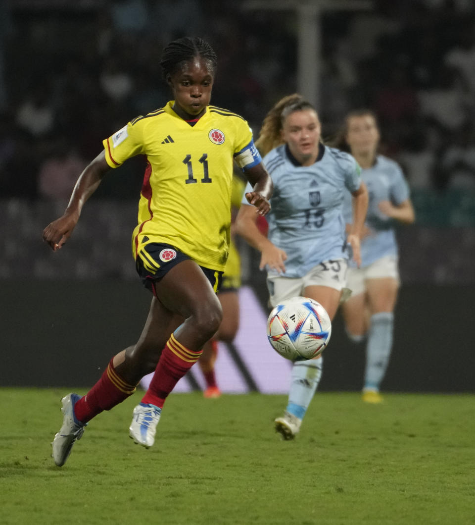 Colombia's Linda Caicedo, left, follows a ball during the FIFA U-17 Women's World Cup final soccer match between Spain and Colombia in Navi Mumbai, India, Sunday, Oct. 30, 2022. (AP Photo/Rafiq Maqbool)