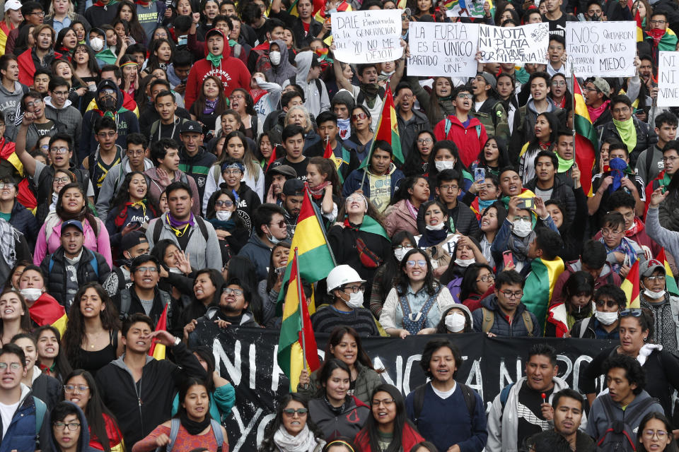 Anti-government protesters march demanding a second round presidential election, in La Paz, Bolivia, Thursday, Oct. 24, 2019. Bolivia's Evo Morales declared himself the outright winner Thursday of an election in which he was seeking a fourth term as president, enraging his opponents who alleged vote fraud and called for further protests to demand a second round of voting.(AP Photo/Juan Karita)