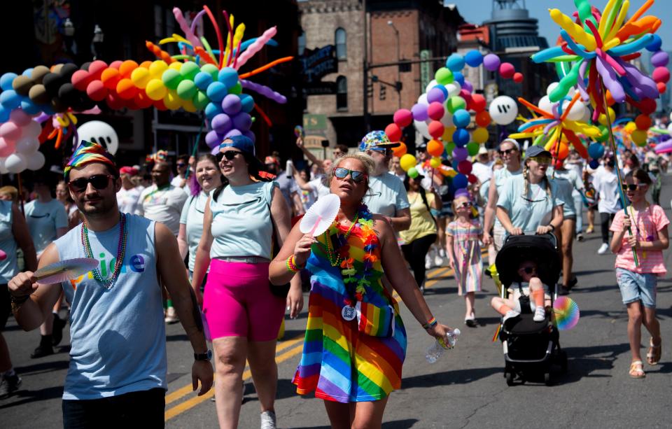 People march in the Pride Festival Parade on Broadway in Nashville , Tenn., Saturday, June 25, 2022.