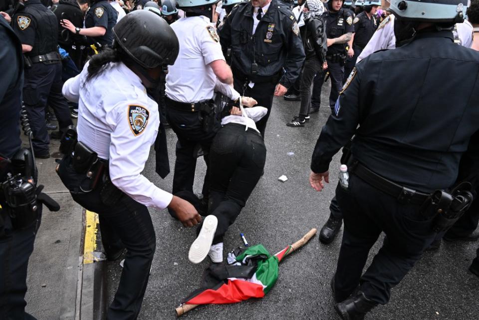 A protestor is hauled away. Paul Martinka for NY Post