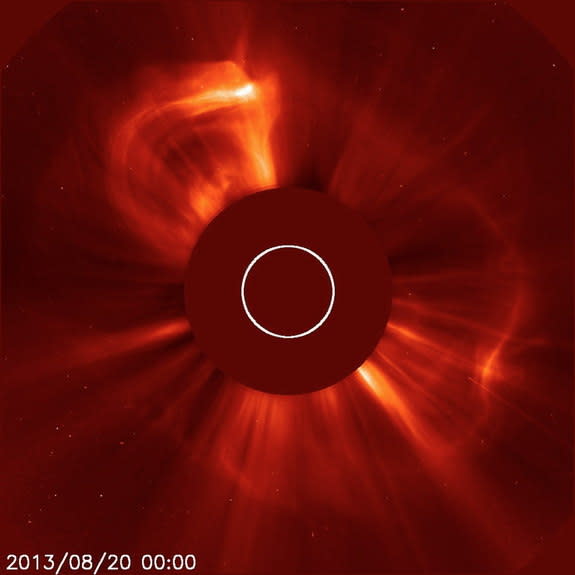 The SOHO LASCO C2 instrument captured this image of the Earth-directed coronal mass ejection or CME. SOHO's coronographs are able to take images of the solar corona by blocking the light coming directly from the Sun with an occulter disk. The l