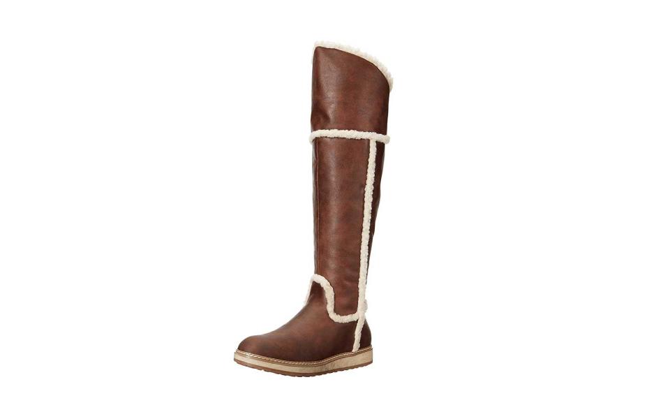 <p>Over-the-knee boots are definitely having a moment on the runway and on the streets. The faux fur on this pair has been treated so it’s water-resistant and will keep your feet dry in the snow. But to be honest—the shearling detail is what actually sold us on these.</p> <p>To buy: <a rel="nofollow noopener" href="https://www.amazon.com/dp/B01DS40FGI" target="_blank" data-ylk="slk:amazon.com;elm:context_link;itc:0;sec:content-canvas" class="link ">amazon.com</a>, $120</p>