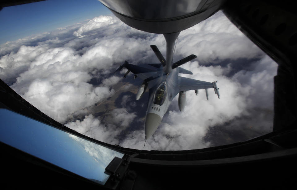 FILE - A U.S. Air Force F-16 refuels in mid-flight from a KC-135 Stratotanker during a Red Flag exercise over The Nevada Test and Training Range on Feb. 10, 2014. President Joe Biden on Friday, May 19, 2023, endorsed plans to train Ukrainian pilots on U.S.-made F-16 fighter jets, according to two people familiar with the matter, as he huddled with allies at the Group of Seven summit on how to bolster support for Kyiv against Russia's invasion. (John Locher/Las Vegas Review-Journal via AP)