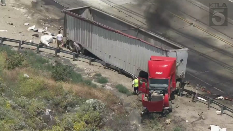 A very large fire tore through a semi-truck on the 5 Freeway on Wednesday afternoon, sending thick plumes of black smoke into the sky and causing heavy traffic delays. (Sky5)