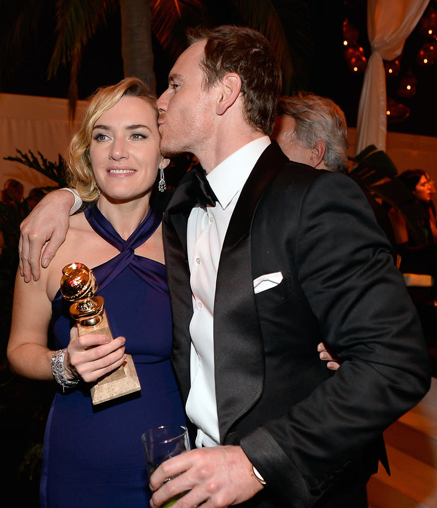 Kate Winslet had two wins on Sunday night: She was awarded a Golden Globe and got a smooch from her hunky “Steve Jobs” co-star Michael Fassbender. (Photo: NBC/Getty Images)