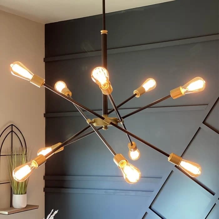 Reviewer's photo of the chandelier in the color Black/Brass