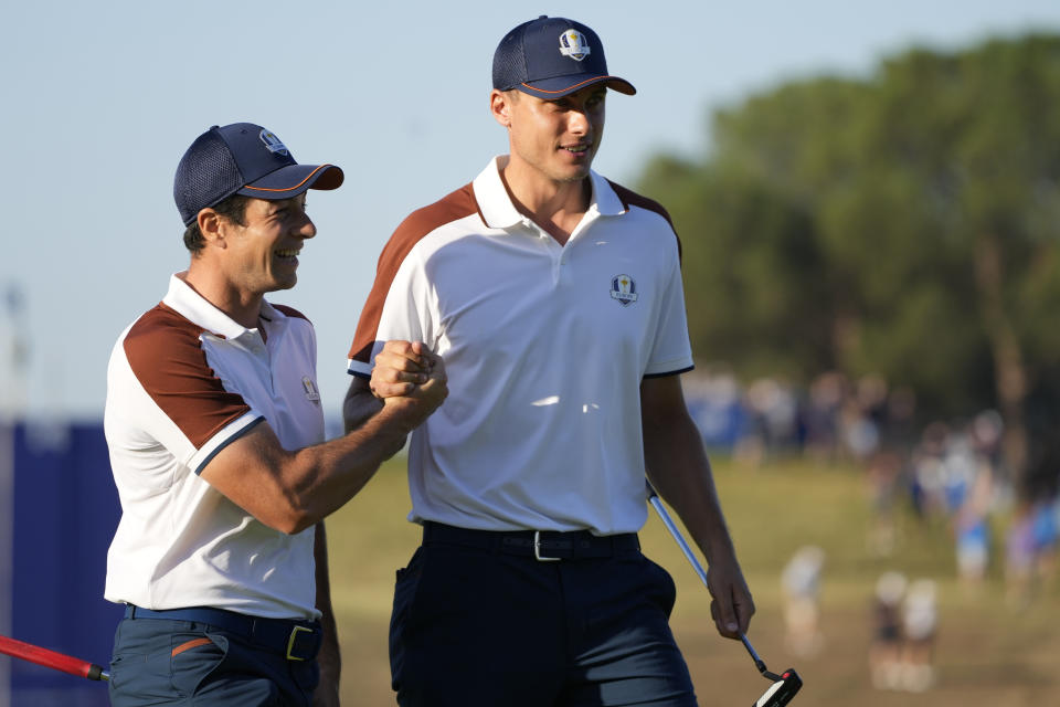 Europe's Ludvig Aberg, right and playing partner Europe's Viktor Hovland celebrate on the 3rd free during their morning Foursomes match at the Ryder Cup golf tournament at the Marco Simone Golf Club in Guidonia Montecelio, Italy, Saturday, Sept. 30, 2023. (AP Photo/Gregorio Borgia )