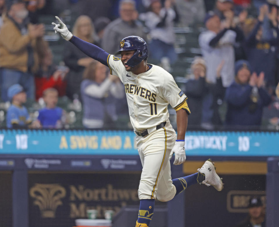 Milwaukee Brewers' Jackson Chourio reacts after hitting a home run during the fifth inning of a baseball game against the Minnesota Twins, Wednesday, April 3, 2024, in Milwaukee. It was his first major league home run. (AP Photo/Jeffrey Phelps)