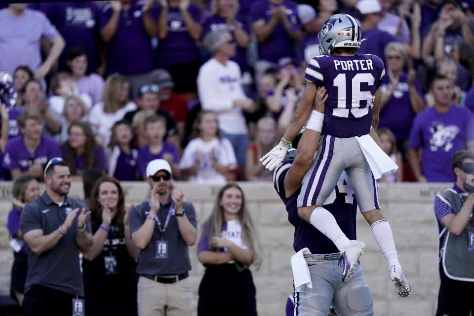 Kansas State wide receiver Seth Porter (16) celebrates with a teammate after blocking a punt resulting in a Kansas State touchdown during the first half of an NCAA college football game against South Dakota Saturday, Sept. 3, 2022, in Manhattan, Kan. (AP Photo/Charlie Riedel)