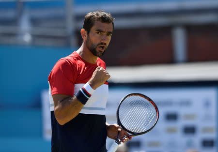 Tennis - ATP 500 - Fever-Tree Championships - The Queen's Club, London, Britain - June 22, 2018 Croatia's Marin Cilic celebrates after winning his quarter final match against Sam Querrey of the U.S. Action Images via Reuters/Tony O'Brien