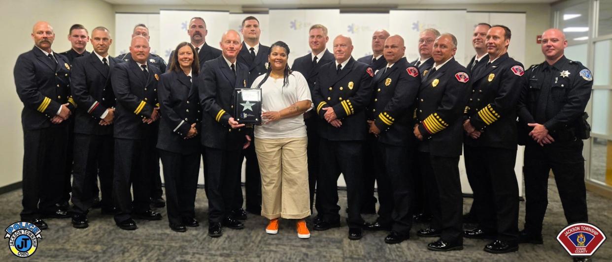 Jackson Township police and firefighter/paramedics received the 2024 EMS Star of Life Award for their life-saving actions after Jonetta Ross, front, center, was seriously injured in a SARTA bus crash on Sept. 25. The Ohio Department of Public Safety’s Division of EMS presented the awards Wednesday in Columbus.