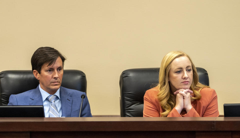 State Sen. Kirk Cullimore and state Rep. Candice Pierucci, co-sponsors of HB215, listen to public comments at the Senate Education Committee in Salt Lake City, Monday, Jan. 23, 2023. Several years of pandemic restrictions and curriculum battles have emboldened longtime advocates of funneling public funds to private and religious schools in statehouses throughout the country. (Rick Egan/The Salt Lake Tribune via AP)