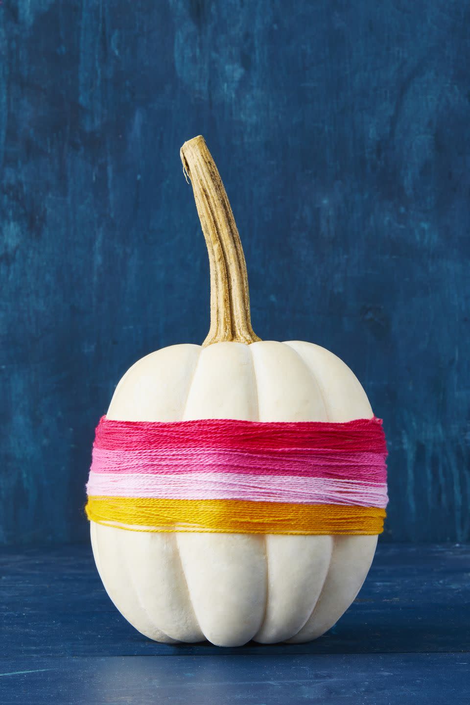 <p>For a quick dash of color, simply wrap strands of embroidery thread around a mini gourd in rainbow order and glue to secure. </p><p><a class="link " href="https://www.amazon.com/Paxcoo-Skeins-Embroidery-Stitch-Needles/dp/B0747JY5Q2?tag=syn-yahoo-20&ascsubtag=%5Bartid%7C10055.g.1566%5Bsrc%7Cyahoo-us" rel="nofollow noopener" target="_blank" data-ylk="slk:SHOP THREAD;elm:context_link;itc:0;sec:content-canvas">SHOP THREAD</a><br></p>