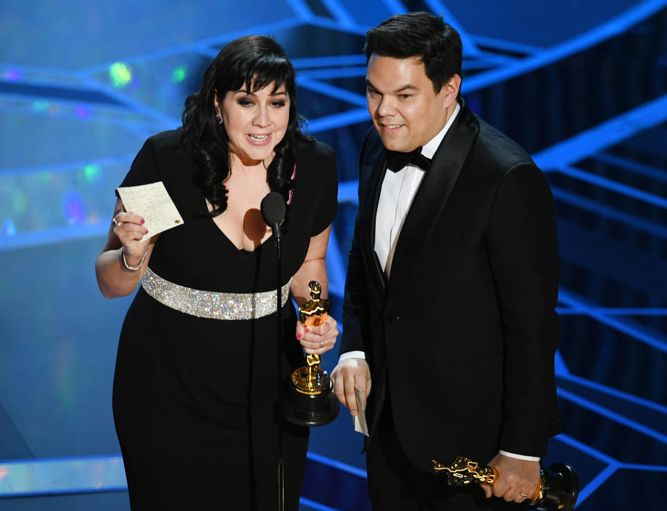 Songwriters Kristen Anderson-Lopez and Robert Lopez accept Best Original Song for 'Remember Me' from 'Coco' onstage during the 90th Annual Academy Awards at the Dolby Theatre at Hollywood & Highland Center on March 4, 2018 in Hollywood.