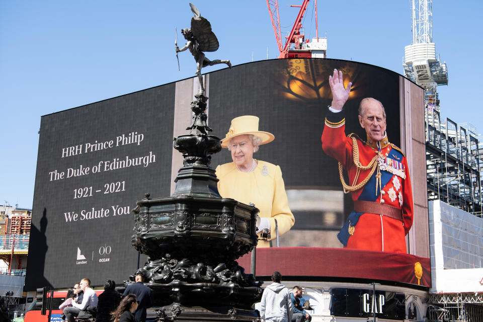 LONDON, ENGLAND - APRIL 17: Images reflecting and celebrating the life of HRH Prince Philip are displayed on the large screen at Piccadilly Circus on April 17, 2021 in London, United Kingdom. The Duke of Edinburgh travelled extensively during his Royal Naval service.  As Prince Consort to HM Queen Elizabeth II he visited 144 countries, he was fluent in French and German. The youth scheme he set up in 1956, The Duke of Edinburgh's Award, is now held in 143 different countries. The Duke died, age 99, at Windsor Castle on April 9, 2021, and his funeral is held today, also at Windsor. (Photo by Jeff Spicer/Getty Images)
