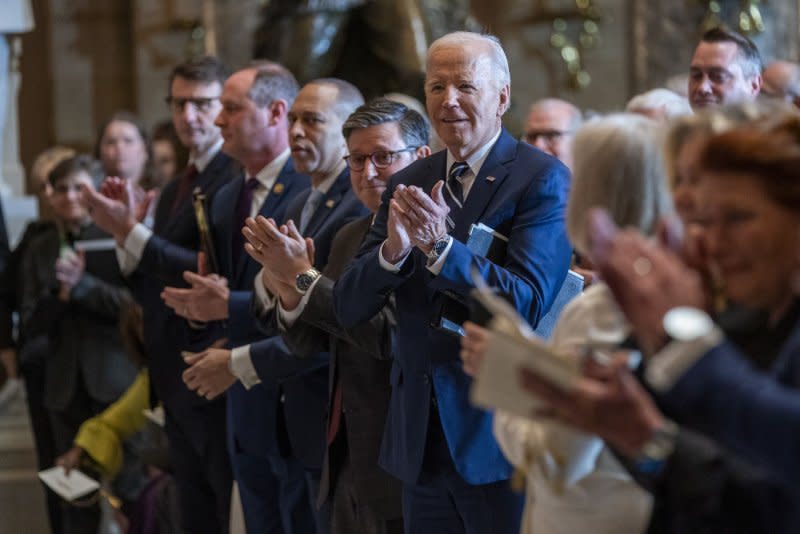 President Joe Biden applauds after a performance by Italian tenor Andrea Bocelli at the National Prayer Breakfast in Statuary Hall of the U.S. Capitol on Thursday. Photo by Shawn Thew/UPI